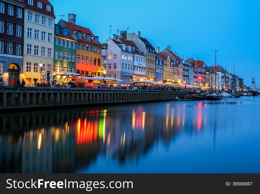 Evening lights over the Nyhavn street, Copenhagen Denmark. Evening lights over the Nyhavn street, Copenhagen Denmark