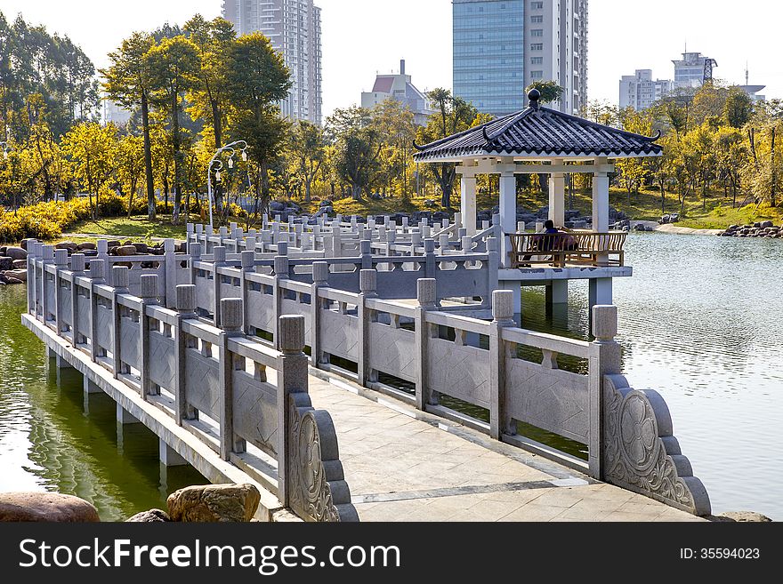 Chinese garden:a winding corridor bridge on water. Chinese garden:a winding corridor bridge on water