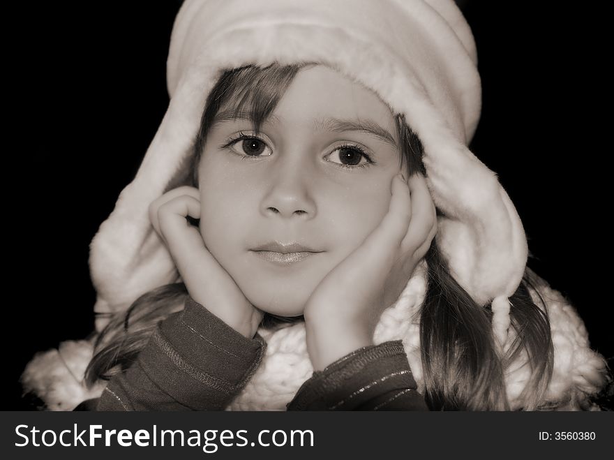 A black and white portrait of a cute young girl. A black and white portrait of a cute young girl