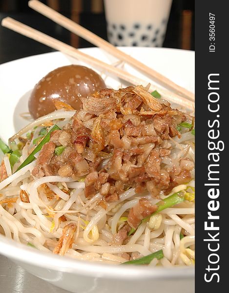 Asian noodle bowl with chopped pork