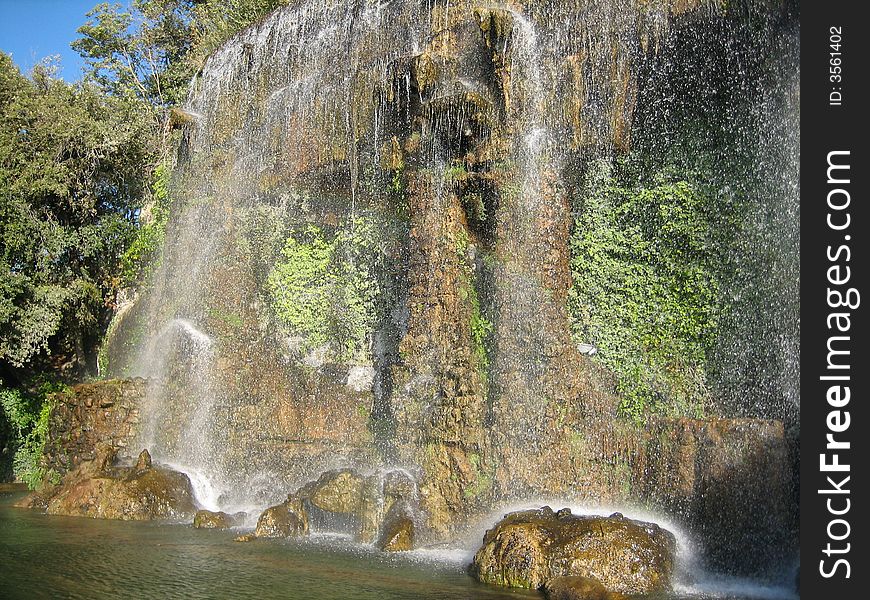 A beautiful waterfall in a park in the South of France