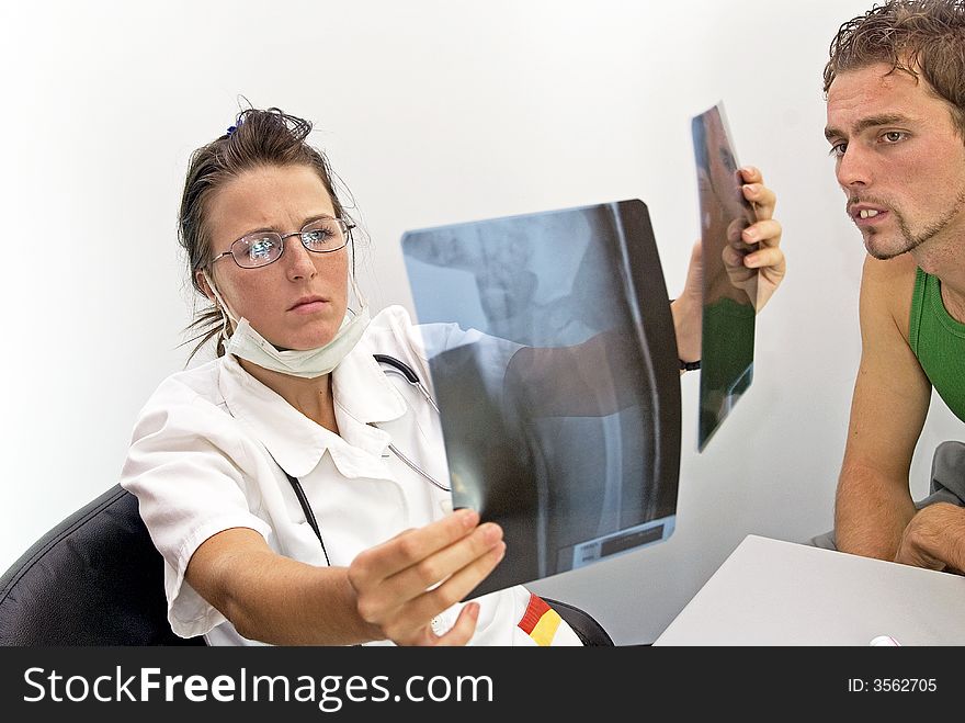 Young female doctor looking radiogram. Young female doctor looking radiogram