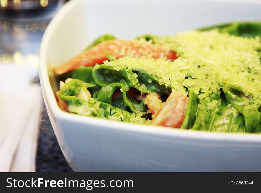 Plate of Green Homemade Pasta with Salmon and Grated Cheese. Plate of Green Homemade Pasta with Salmon and Grated Cheese.