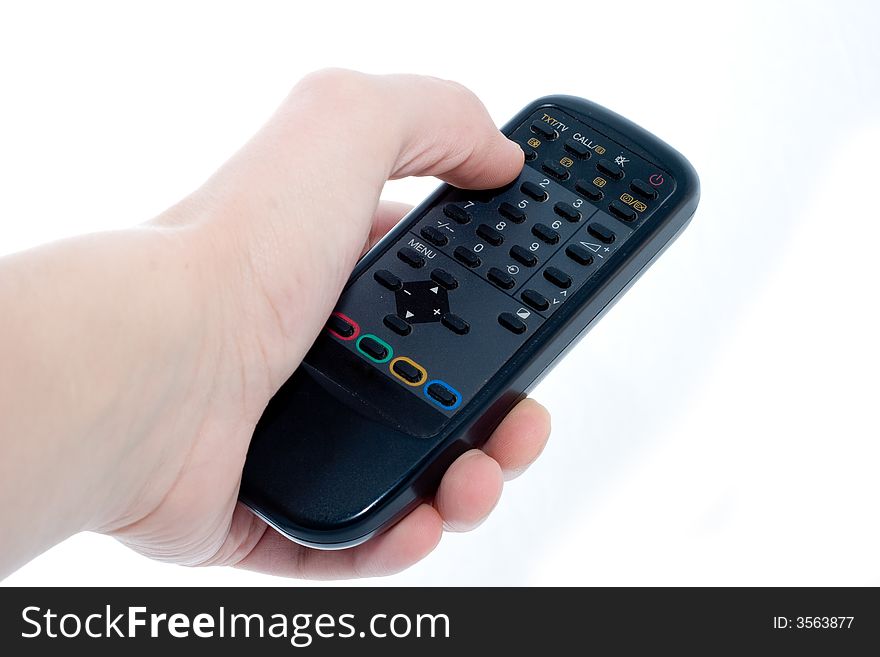 Black Infrared remote control unit in hand on a white background