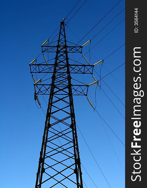 Big Power Line tower isolated on blue sky. Big Power Line tower isolated on blue sky