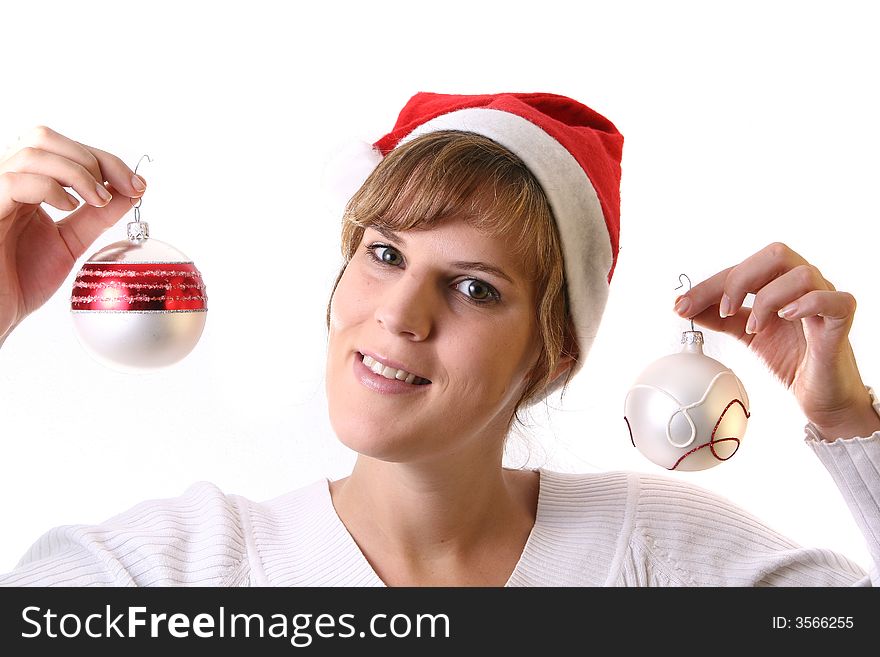 A young beautiful cute and happy Christmas woman is smiling. Isolated over white with a Christmas glitter balls. A young beautiful cute and happy Christmas woman is smiling. Isolated over white with a Christmas glitter balls.