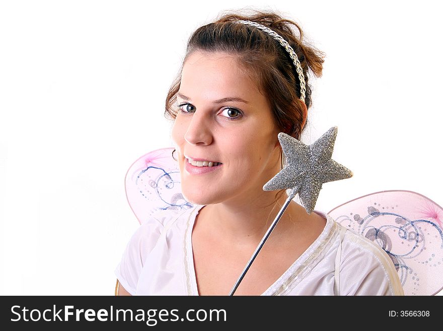 A young beautiful cute and happy Christmas fairy with wings and a magic wand getting ready for Christmas! Isolated over white!. A young beautiful cute and happy Christmas fairy with wings and a magic wand getting ready for Christmas! Isolated over white!