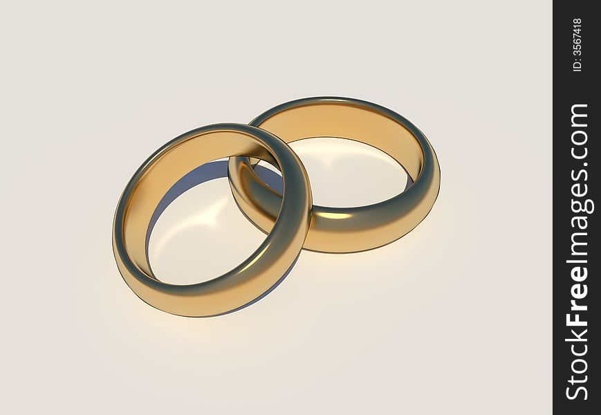 Golden wedding rings with caustic on white background