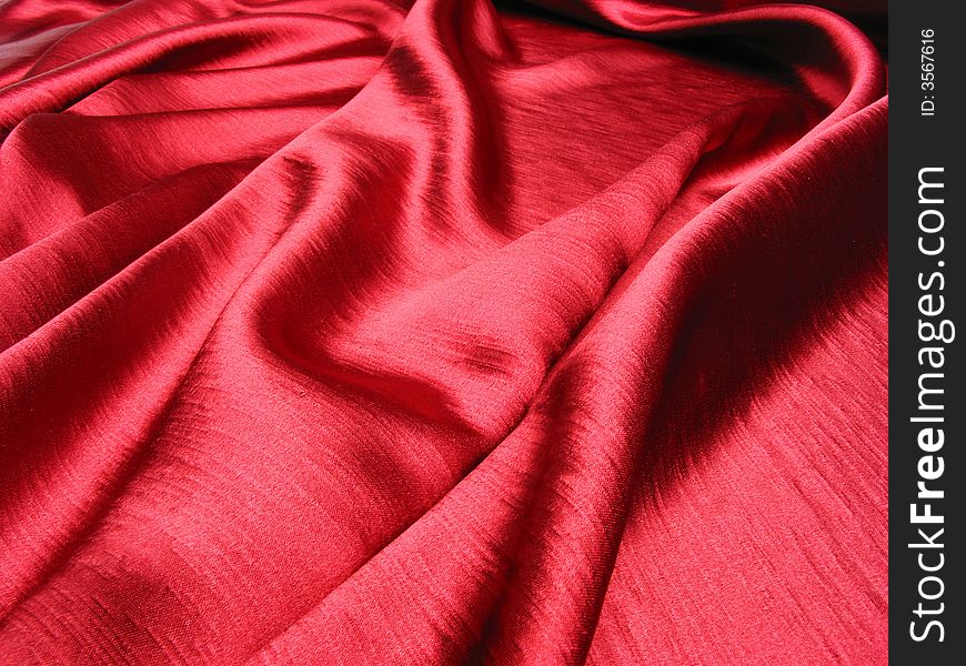 Soft,red,reflective satin background. Soft,red,reflective satin background