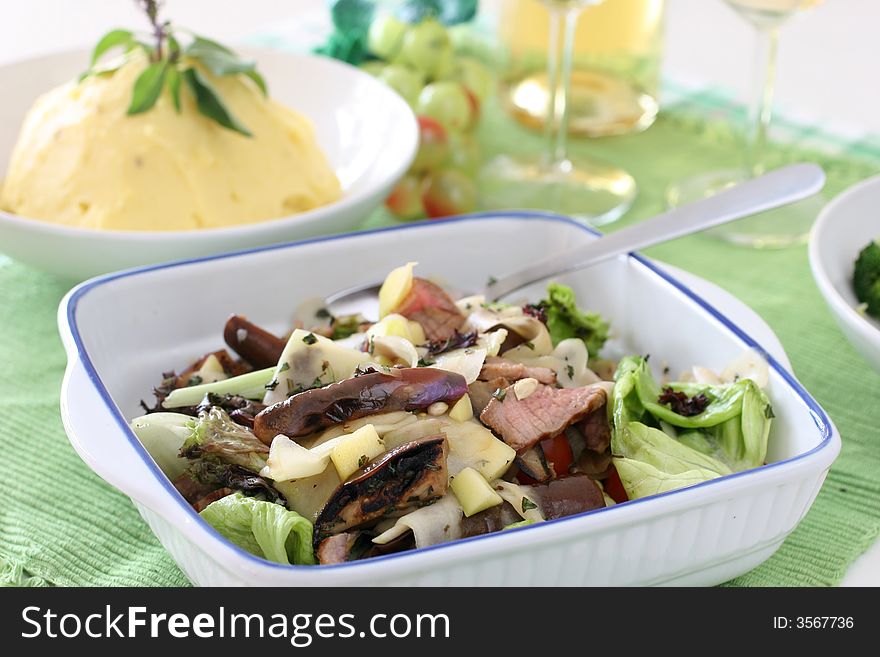 Healthy and light mushroom, fresh lettuce, brinjal and sliced grilled beef salad