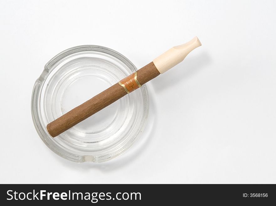 Close up of cigar and ash-tray on white background. Close up of cigar and ash-tray on white background