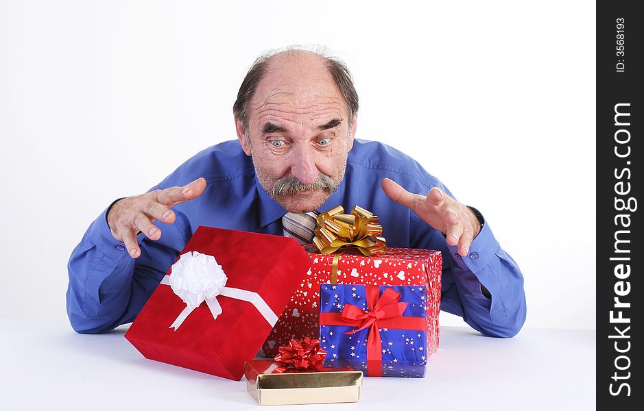 Greedy man with pile of gifts. Greedy man with pile of gifts