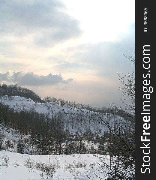 Sunset and typical italian winter landscape on a tuscany mountain. March 2005. Il Magat