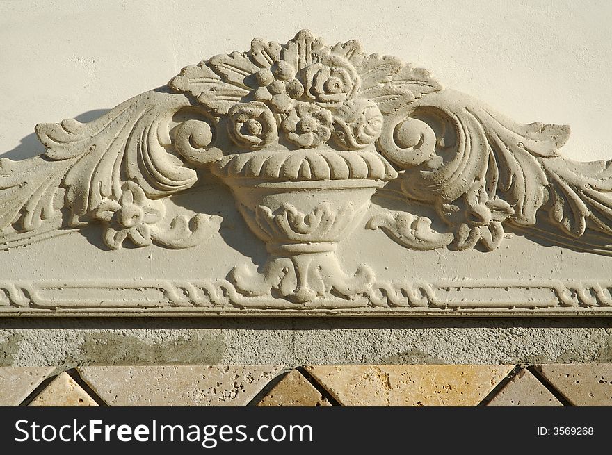 Ornate Design Element on Stucco Wall
