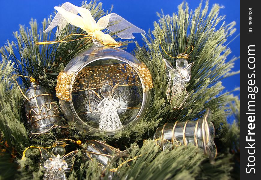 Three angels and bulbs  on Christmas tree. Three angels and bulbs  on Christmas tree