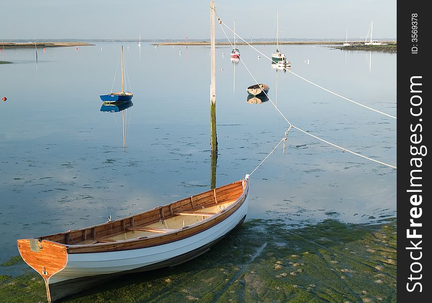 Boats in the autumn evening sun with reflection in the water. Boats in the autumn evening sun with reflection in the water