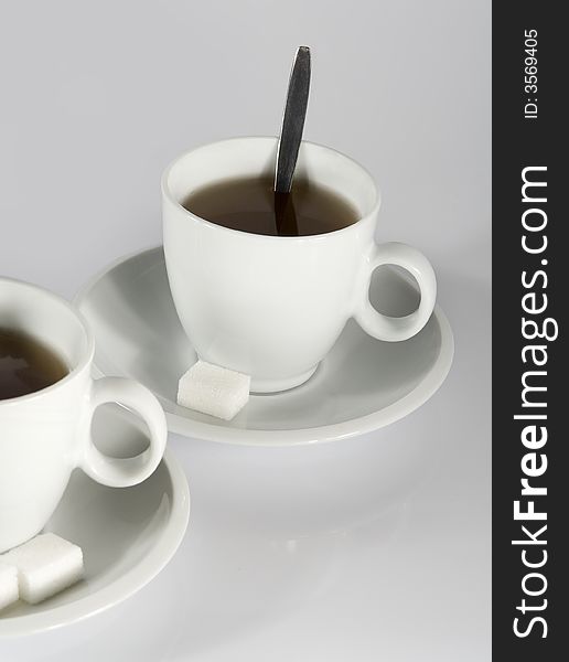 Detail of cup of tea on gray background. Detail of cup of tea on gray background