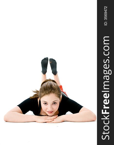 A young caucasian girl doing different stretches. A young caucasian girl doing different stretches