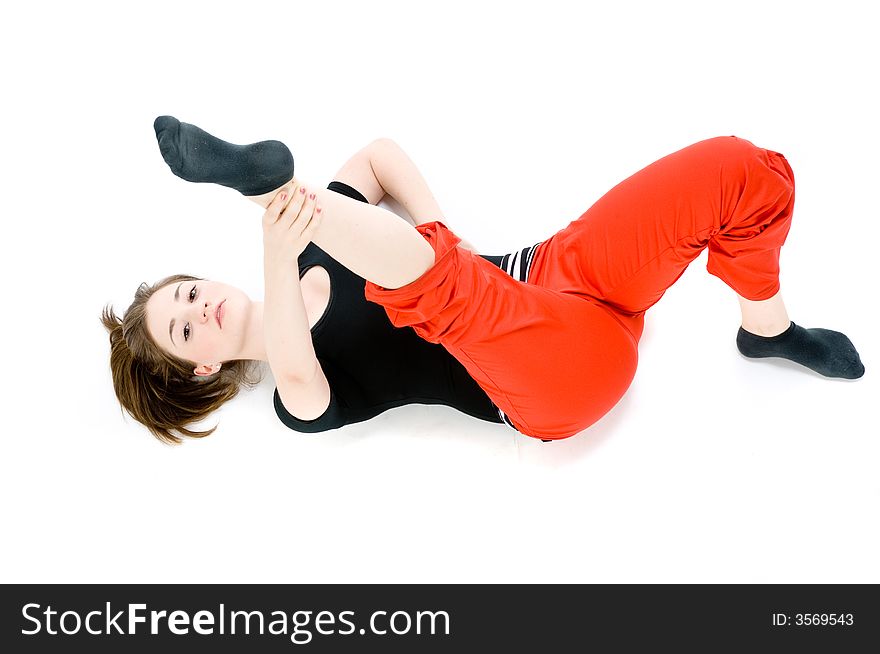 A young caucasian girl doing different stretches. A young caucasian girl doing different stretches