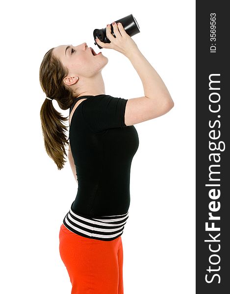 Young caucasian girl drinking from an exercise bottle. Young caucasian girl drinking from an exercise bottle