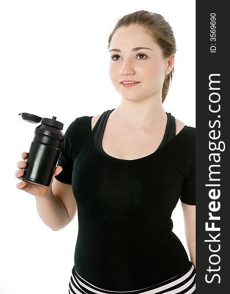 Young caucasian girl drinking from an exercise bottle. Young caucasian girl drinking from an exercise bottle