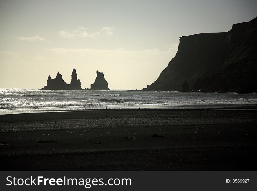Silhouetted sea stacks Vik Iceland