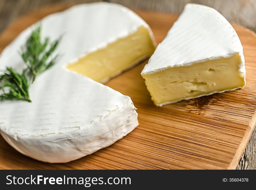 Camembert cheese on the cutting board