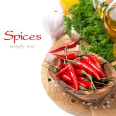 Fresh Chili Pepper Garlic, Spices And Oil On A Board Stock Images Fresh Chili Pepper Garlic, Spices And Oil On A Board Stock Images