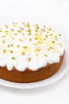 Orange Cake With Greek Yogurt, Honey And Pistachios On A Plate Stock Photo Orange Cake With Greek Yogurt, Honey And Pistachios On A Plate Stock Photo