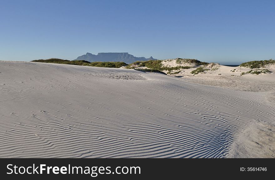 Landscape with sand dune and Table Mountain