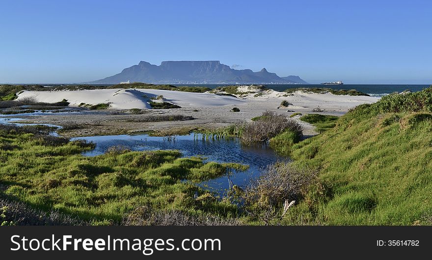 Landscape with sand dunes and Table Mountain