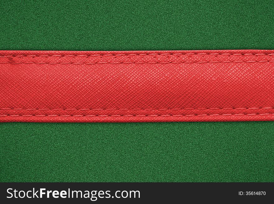 Red label on green grass background, leather label on green background. Red label on green grass background, leather label on green background