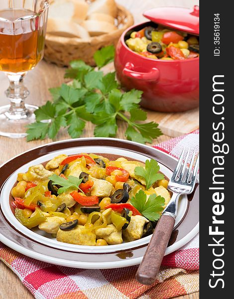 Delicious chicken stew with chickpeas, peppers and onions