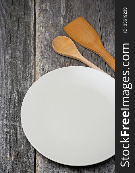 Empty Plate, Wooden Spatula And Spoon, Concept