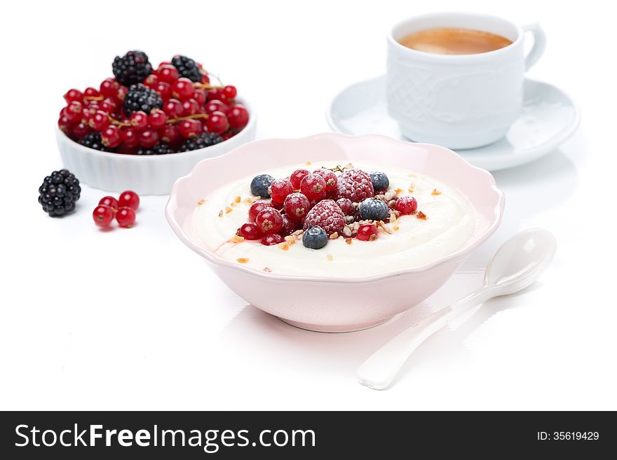 Semolina porridge with fresh berries, nuts and espresso, isolated on white