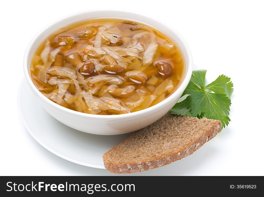 Traditional Russian cabbage soup (shchi) with mushrooms, isolated on white. Traditional Russian cabbage soup (shchi) with mushrooms, isolated on white