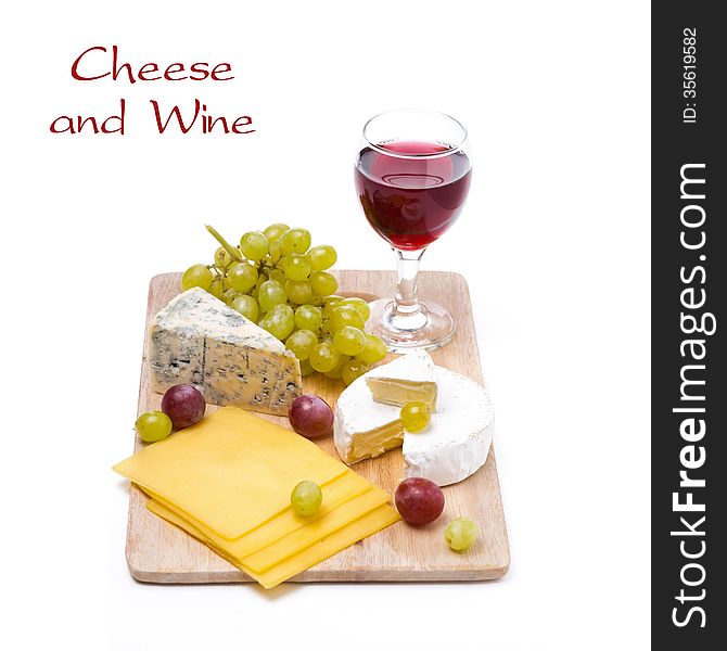 Three kinds of cheese, grapes and wine, isolated