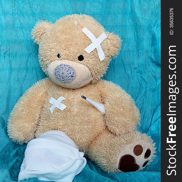 The injured bear on a blue background