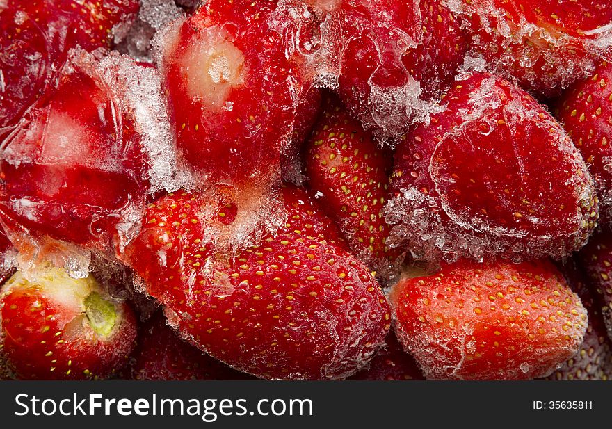 Full frame background red frozen frosty strawberry. Full frame background red frozen frosty strawberry