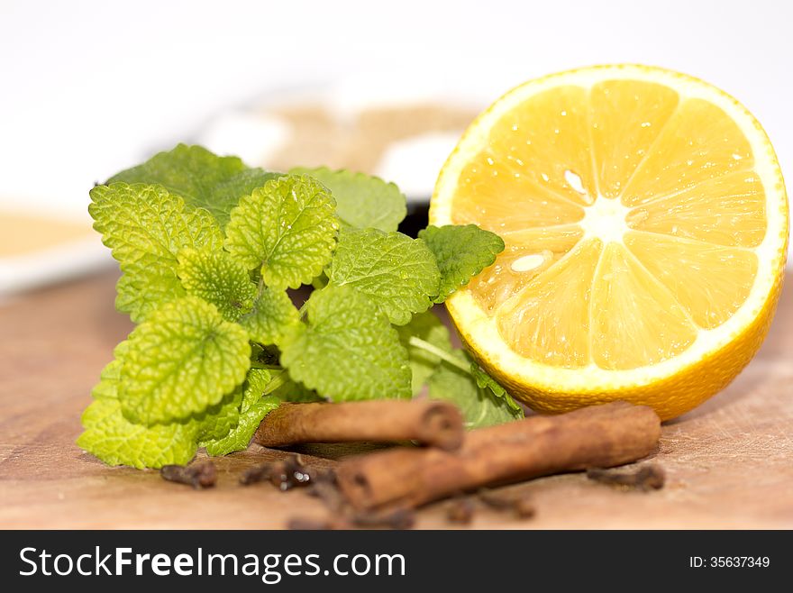 Lemon and cinnamon with lemon grass on blurred background.