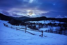Fence By The Road To Snowy Forest In The Mountains Royalty Free Stock Images Fence By The Road To Snowy Forest In The Mountains Royalty Free Stock Images
