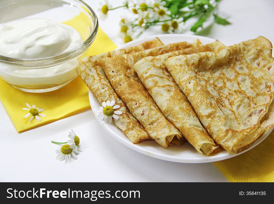 Russian pancakes with sour cream