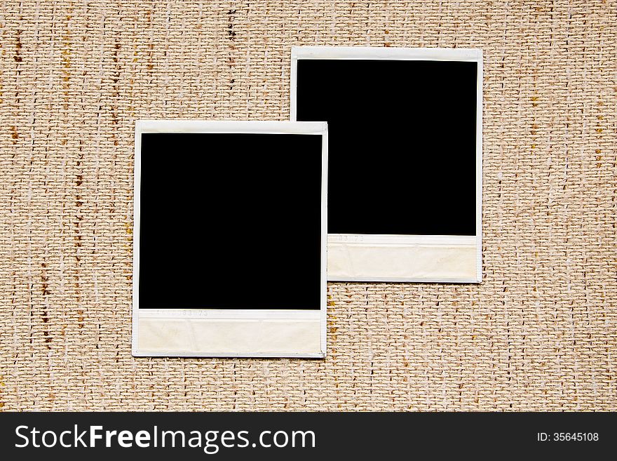 Old empty photo frames on linen texture