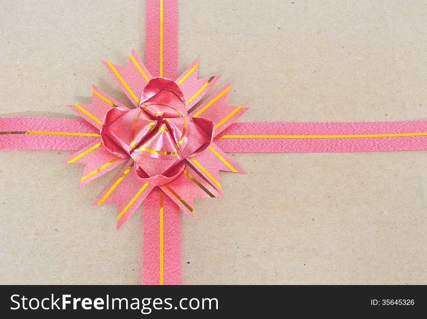 Ribbon and bow on brown gift box