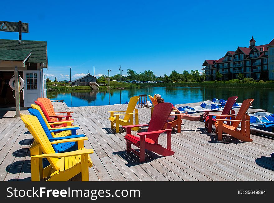 Chairs on a wooden deck near the boat station opposite the hotel. Chairs on a wooden deck near the boat station opposite the hotel