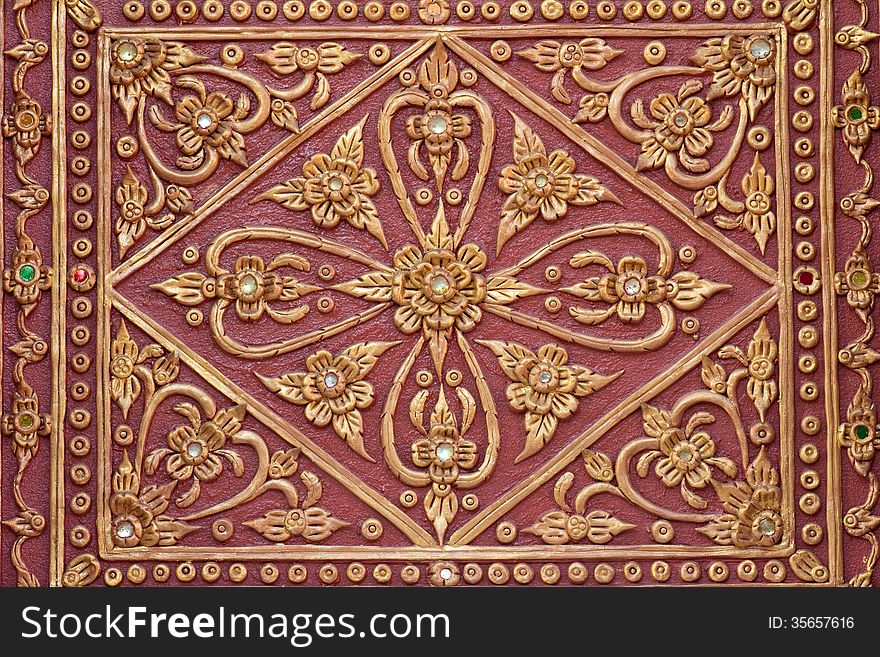 Pattern stucco gold red temple wall background