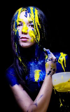 Beauty/fashion Close Up Portrait Of Woman Painted Blue And Yellow With Brushes And Paint  On Black Background Stock Image