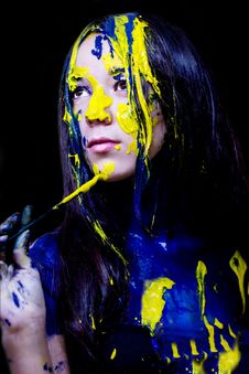 Beauty/fashion Close Up Portrait Of Woman Painted Blue And Yellow With Brushes And Paint  On Black Background Royalty Free Stock Images