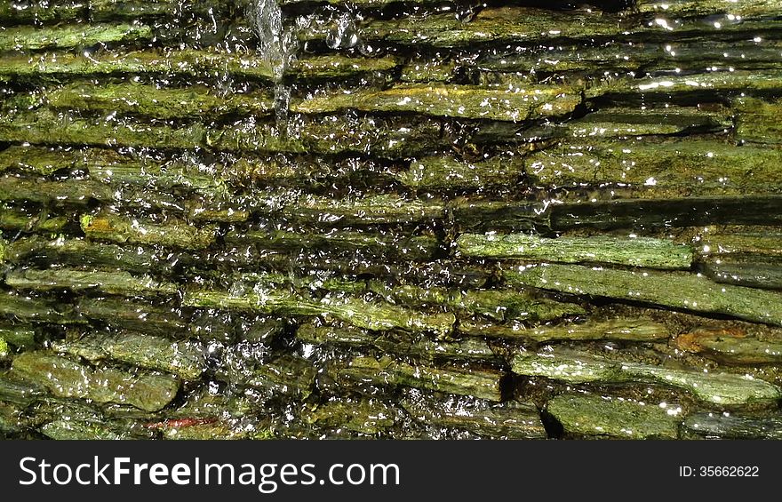 Waterfall Flowing Over a Rocky Wall