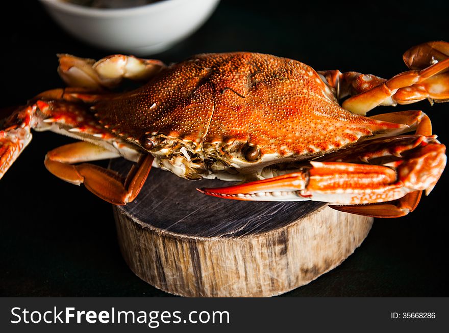 Red steamed blue crab at beach restaurant